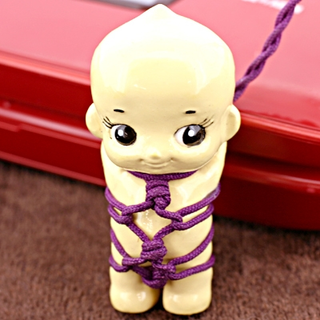 Illustration for article titled Kewpie Bondage Cellphone Charms Give Us Utterly Horrific Nightmares